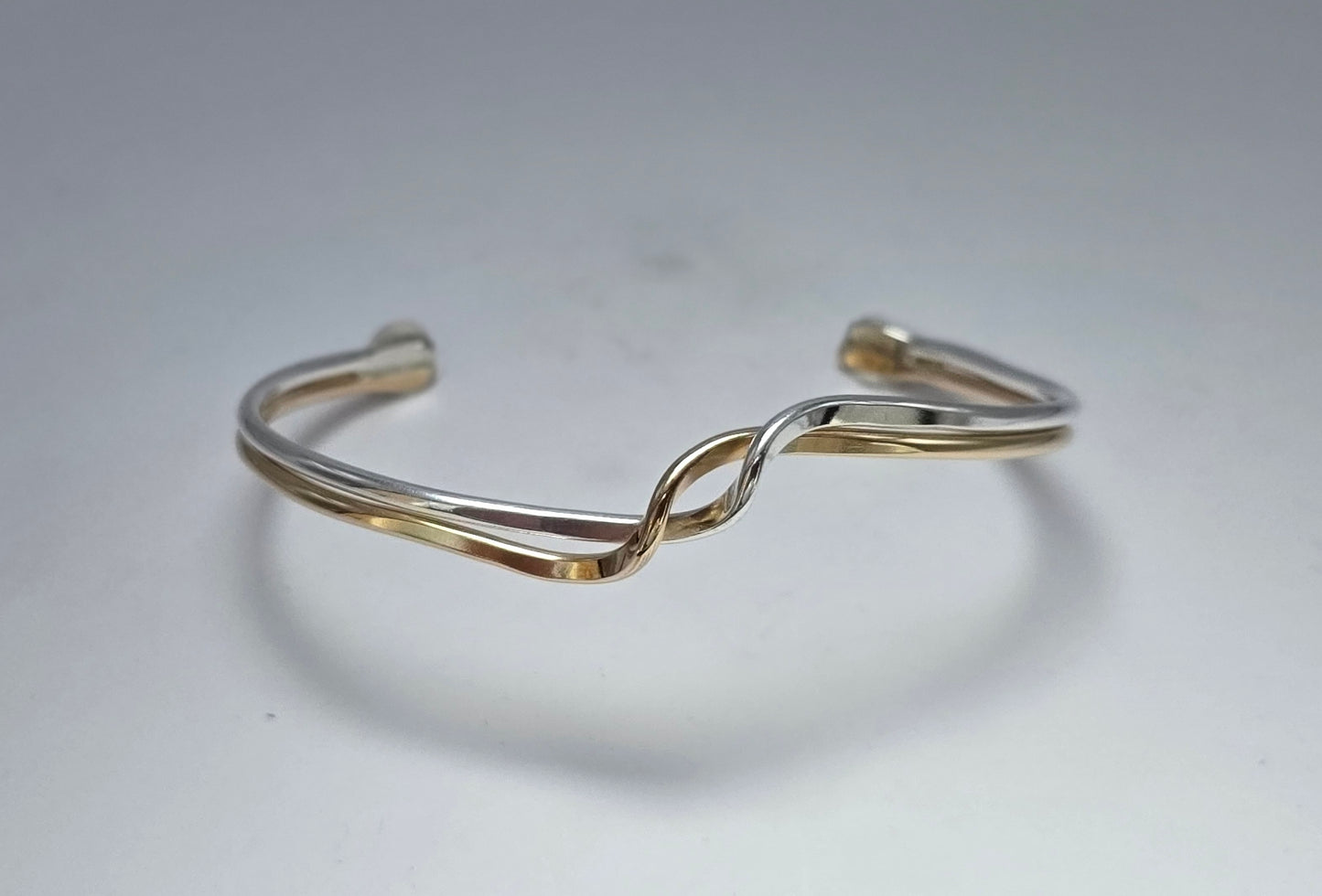 Two toned smooth Sterling Silver and 14kt gold filled wave bracelet