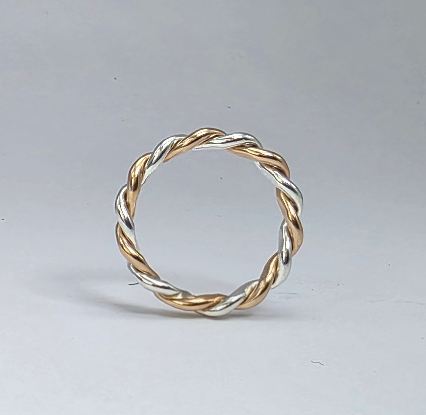 Two-toned smooth silver twist ring 2/16" wide