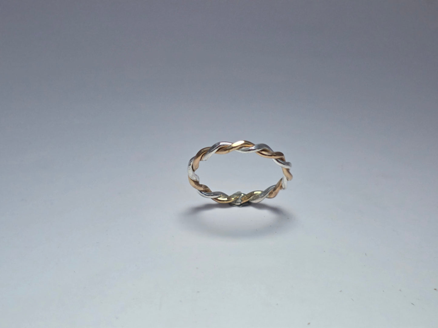 Two-toned smooth silver twist ring 1/16" wide