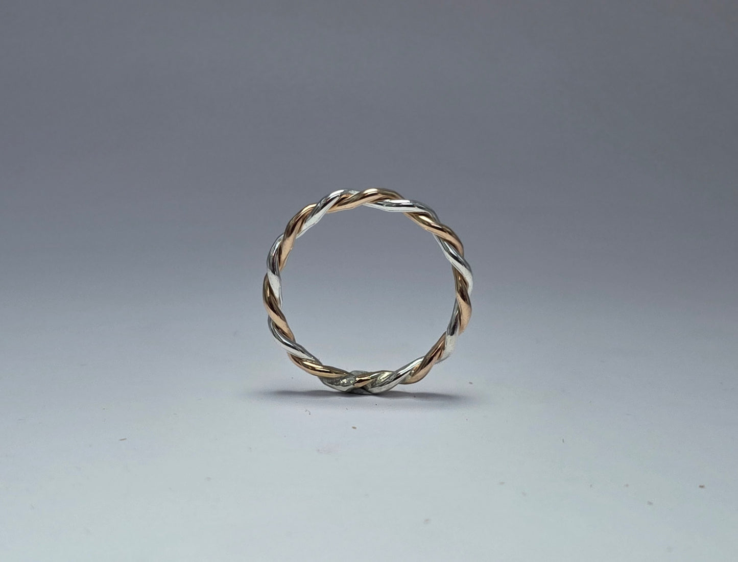 Two-toned smooth silver twist ring 1/16" wide